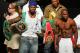 Rapper 50 Cent holds up Floyd Mayweather Jr. belts at the weigh-in at the MGM Grand Garden Arena photo