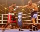 Russian boxer Nicolai Valuev, right, lands a blow on his challenger US boxer Clifford Etienne photo